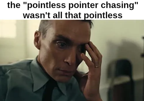 A meme in the "Oppenheimer head in hand" format. The caption reads: "the 'pointless pointer chasing' wasn't all that pointless."